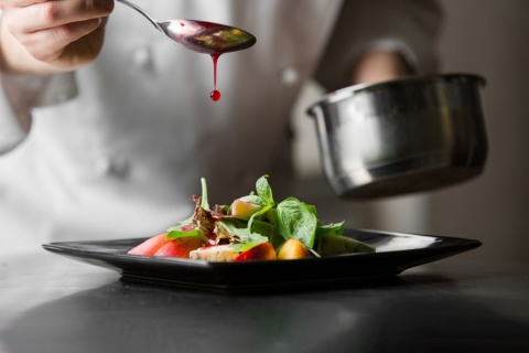 Chef plating a haute cuisine dish