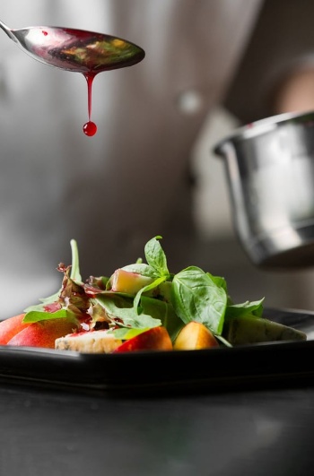 Chef plating a haute cuisine dish