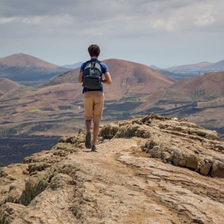 Tourist in the nature reserve of the volcanoes in Lanzarote, Canary Islands