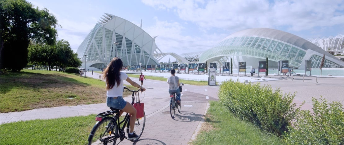 Tourists on bikes in the Turia Garden in Valencia, region of Valencia