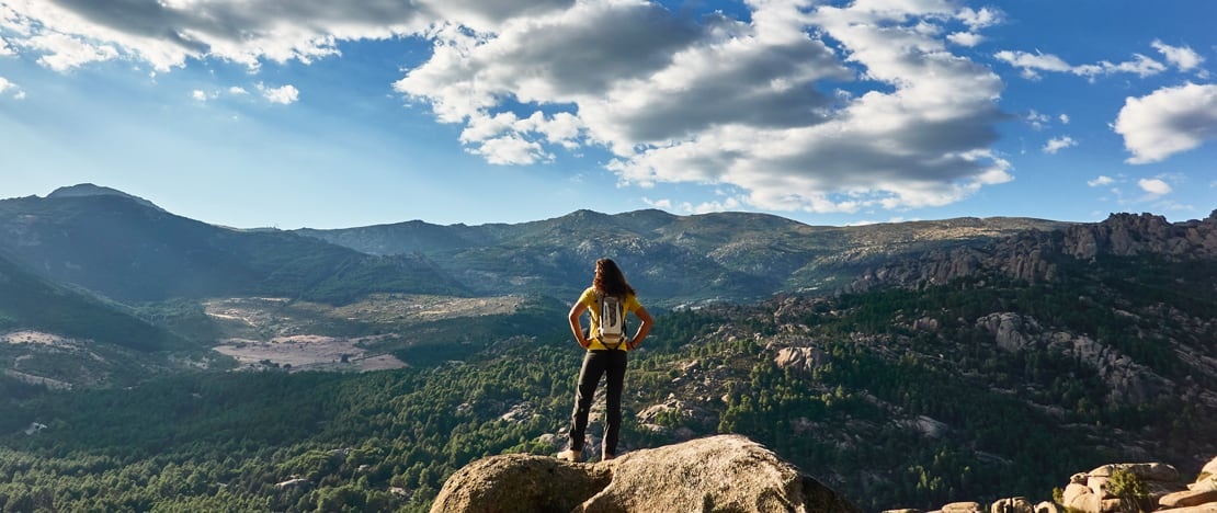 Tourist looking at the Sierra de Guadarrama and Montes de Valsaín National Park, region of Madrid